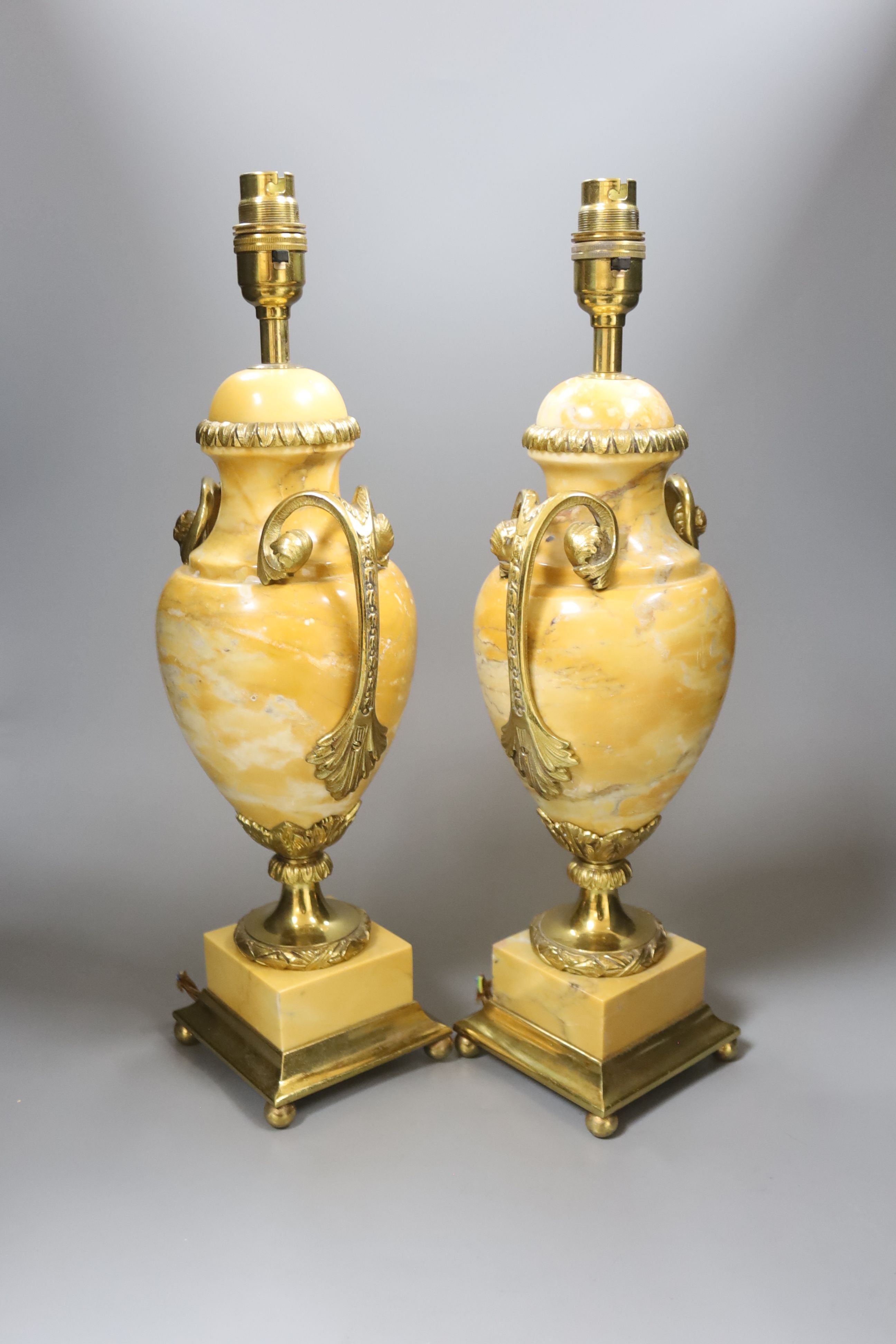 A pair of 20th century French marble and ormolu urn shape table lamps, overall height 43cm